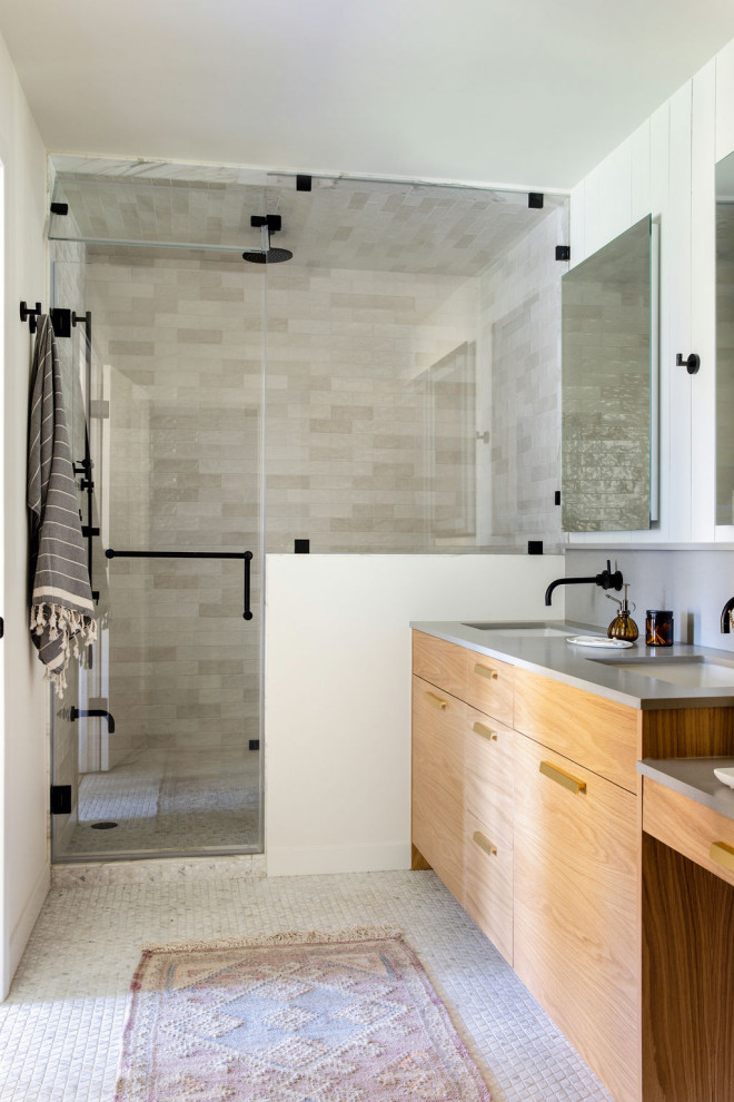 Photo of a large country master wet room bathroom in San Francisco with flat-panel cabinets, brown cabinets, a one-piece toilet, white tile, ceramic tile, white walls, marble floors, a drop-in sink, engineered quartz benchtops, white floor, a hinged shower door, grey benchtops, a shower seat, a double vanity, a built-in vanity and panelled walls.