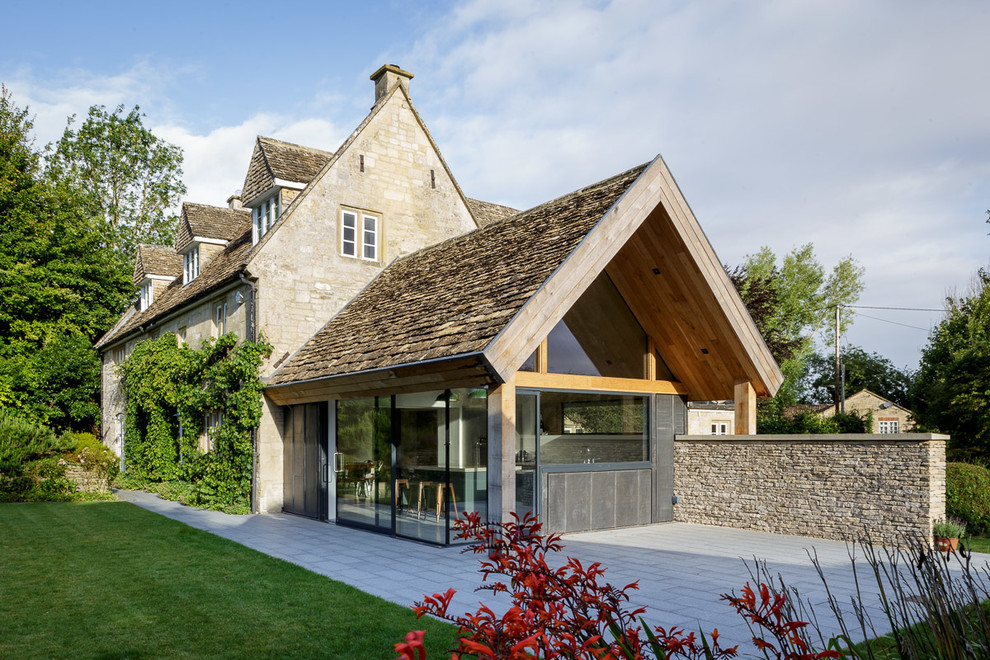 Photo of a mid-sized contemporary one-storey exterior in Wiltshire with mixed siding and a gable roof.