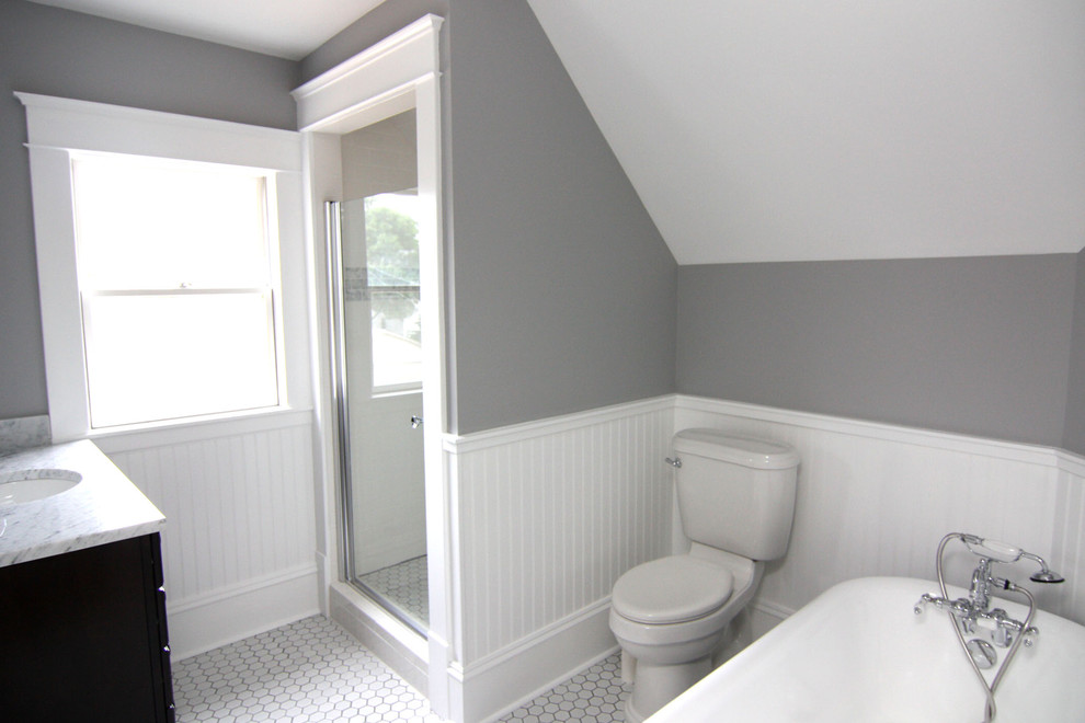 Small traditional master bathroom in Minneapolis with a claw-foot tub, a corner shower, a two-piece toilet, white tile, subway tile, grey walls and ceramic floors.
