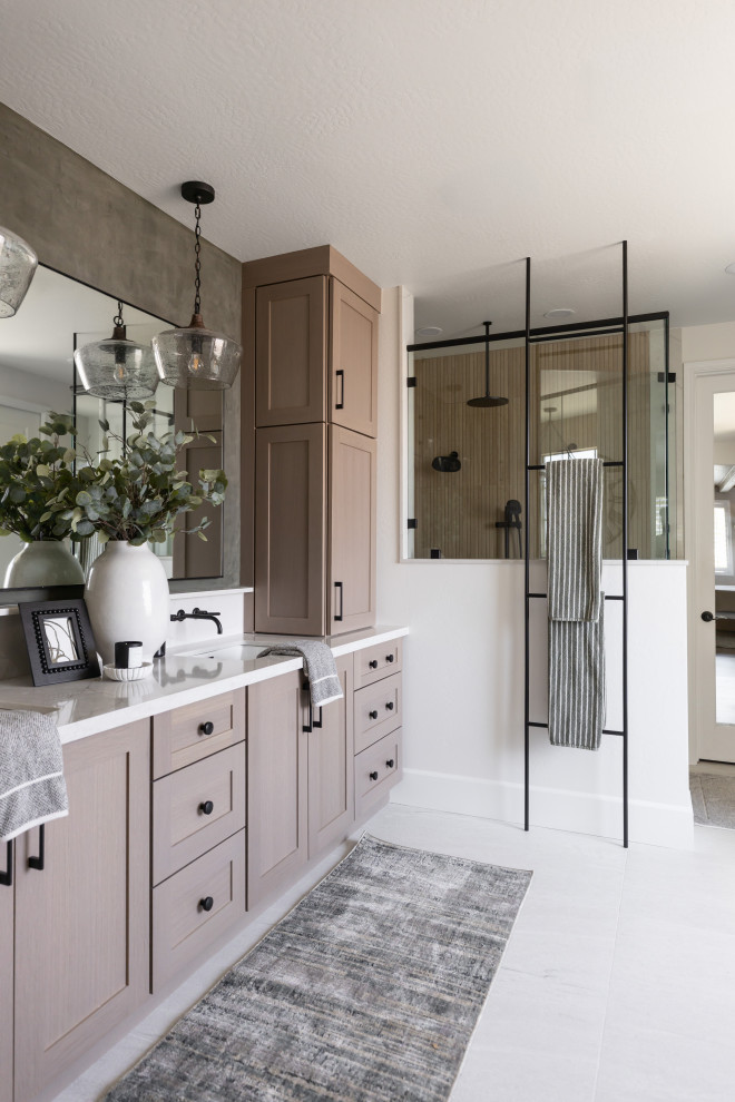 Corner shower - transitional master beige tile white floor and double-sink corner shower idea in Phoenix with shaker cabinets, medium tone wood cabinets, white walls, an undermount sink, a hinged shower door, white countertops and a built-in vanity