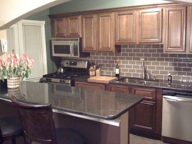 Kitchen - transitional kitchen idea in DC Metro with beaded inset cabinets, dark wood cabinets and granite countertops