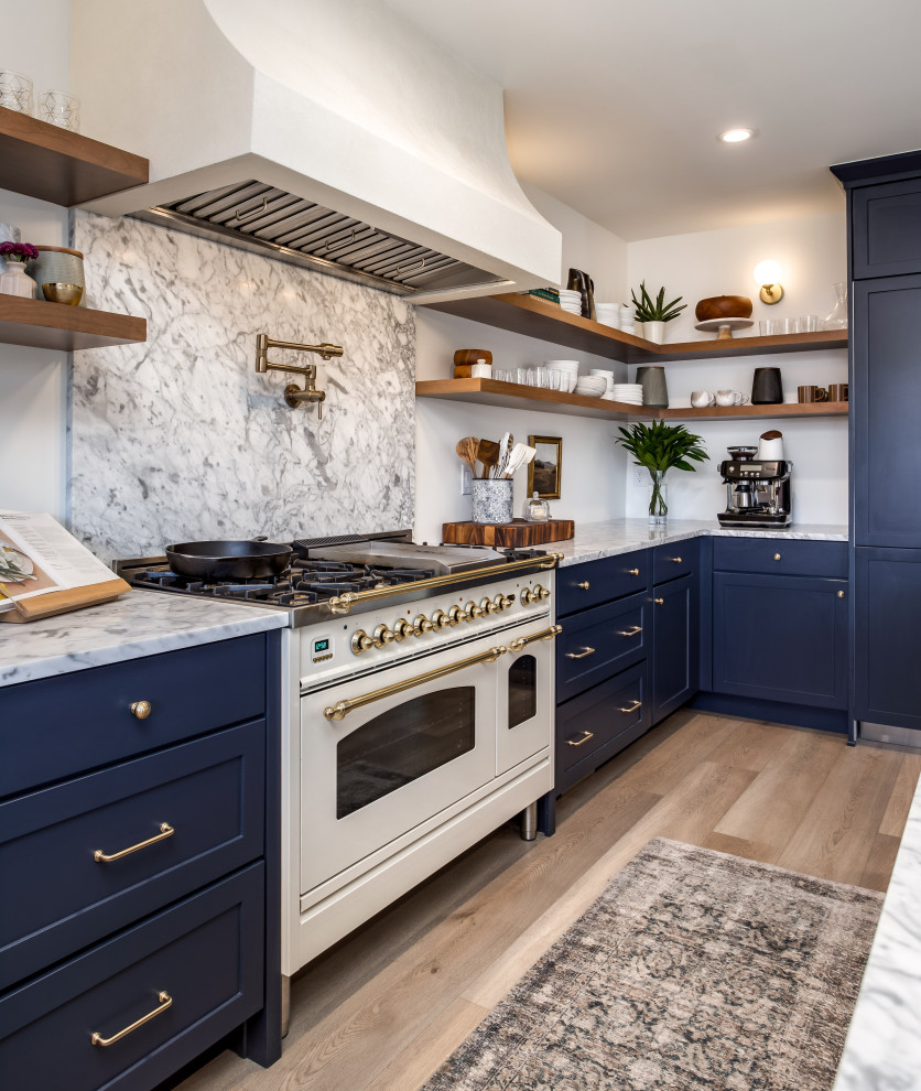 Example of a transitional kitchen design in Denver