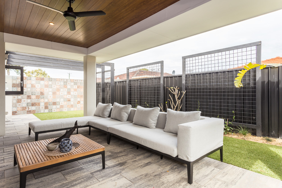 Photo of a contemporary patio in Perth with tile and a roof extension.
