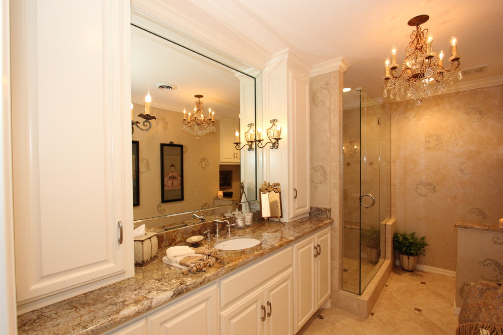 Small traditional master bathroom in Other with recessed-panel cabinets, white cabinets, a corner shower, beige tile, ceramic tile, multi-coloured walls, ceramic floors, an undermount sink, granite benchtops, beige floor and a hinged shower door.