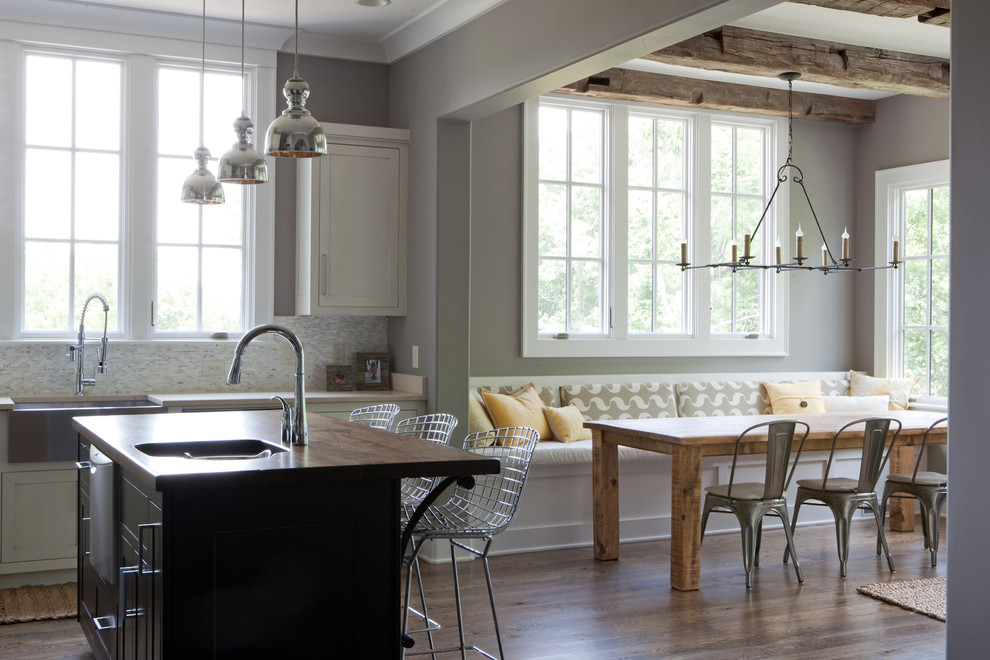 Inspiration for a contemporary eat-in kitchen in Nashville with a farmhouse sink, wood benchtops and grey splashback.