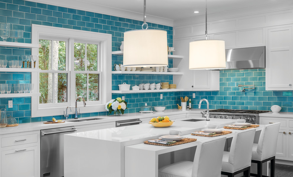 Inspiration for a beach style l-shaped kitchen in Orange County with a double-bowl sink, open cabinets, white cabinets, blue splashback, subway tile splashback, stainless steel appliances and with island.
