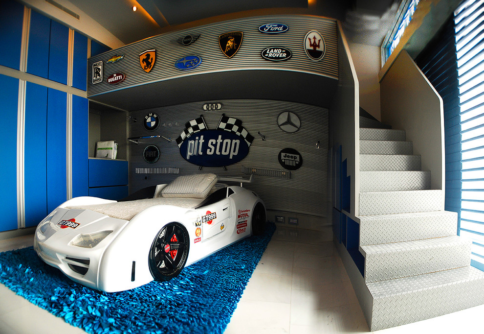 This is an example of a mid-sized contemporary kids' bedroom for kids 4-10 years old and boys in Miami with blue walls, ceramic floors and white floor.