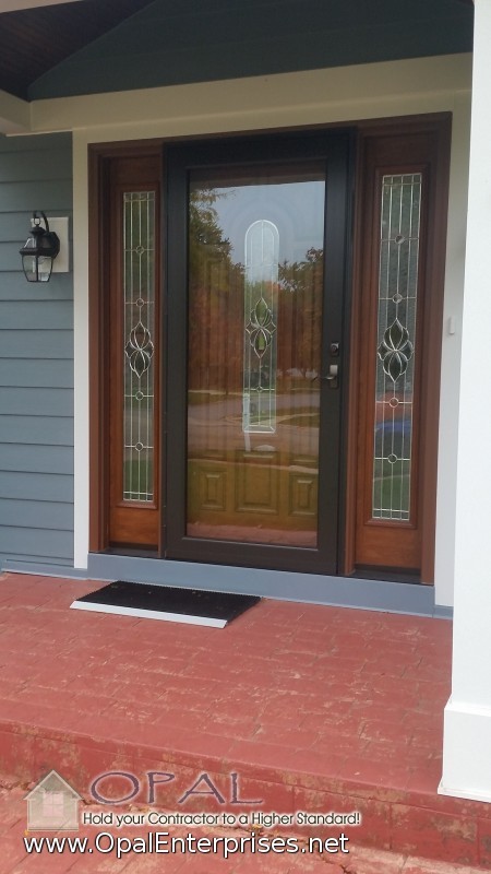 This is an example of a mid-sized traditional front door in Chicago with blue walls, terra-cotta floors, a single front door and a medium wood front door.
