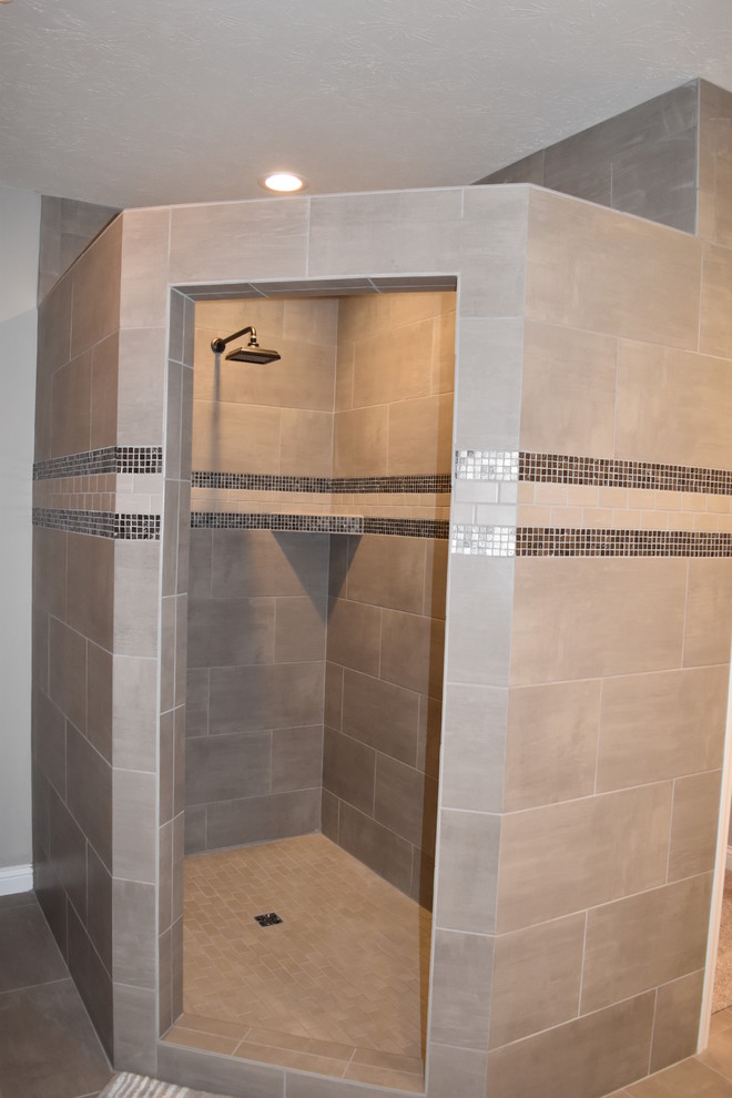 Photo of a mid-sized transitional master bathroom in Other with shaker cabinets, dark wood cabinets, an alcove shower, white walls, an integrated sink, engineered quartz benchtops, beige tile, porcelain tile and porcelain floors.