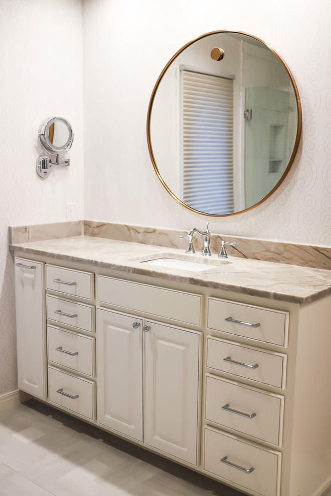 Inspiration for a mid-sized transitional master white tile and marble tile ceramic tile and gray floor alcove bathtub remodel with gray walls, beaded inset cabinets, white cabinets, a two-piece toilet, an undermount sink, quartzite countertops and a hinged shower door