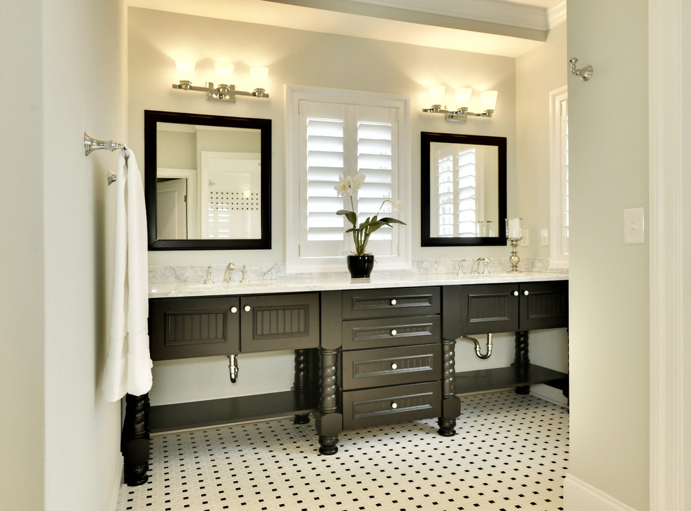 Photo of a beach style bathroom in Other with black cabinets and black and white tile.