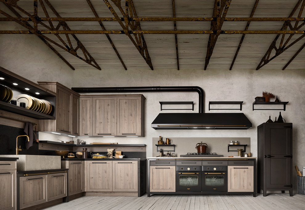 Photo of a large modern l-shaped open plan kitchen in Austin with a double-bowl sink, flat-panel cabinets, concrete benchtops, black splashback, cement tile splashback, panelled appliances, light hardwood floors, with island, brown floor and black benchtop.