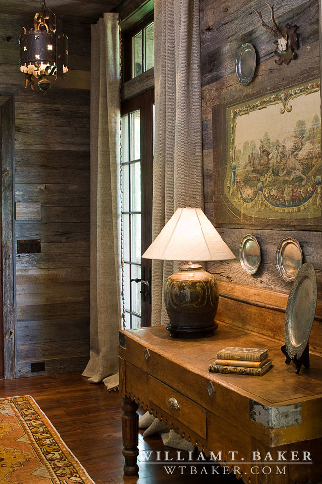 Inspiration for a mid-sized country hallway in Atlanta with brown walls and dark hardwood floors.