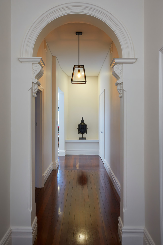Design ideas for a traditional foyer in Perth with white walls and dark hardwood floors.