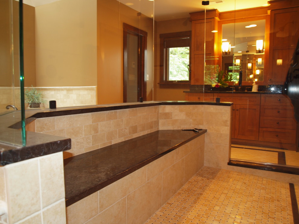 Photo of a large traditional master bathroom in Chicago with shaker cabinets, medium wood cabinets, a double shower, beige tile and beige walls.