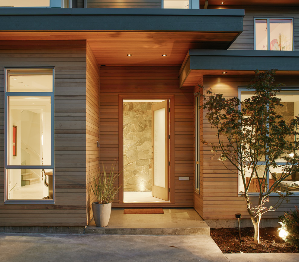 Mid-sized contemporary front door in Vancouver with light hardwood floors, a single front door and a light wood front door.