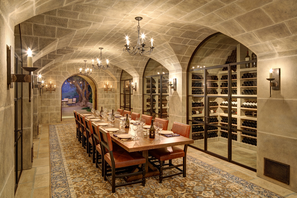 Design ideas for an expansive mediterranean wine cellar in San Francisco with travertine floors, display racks and beige floor.