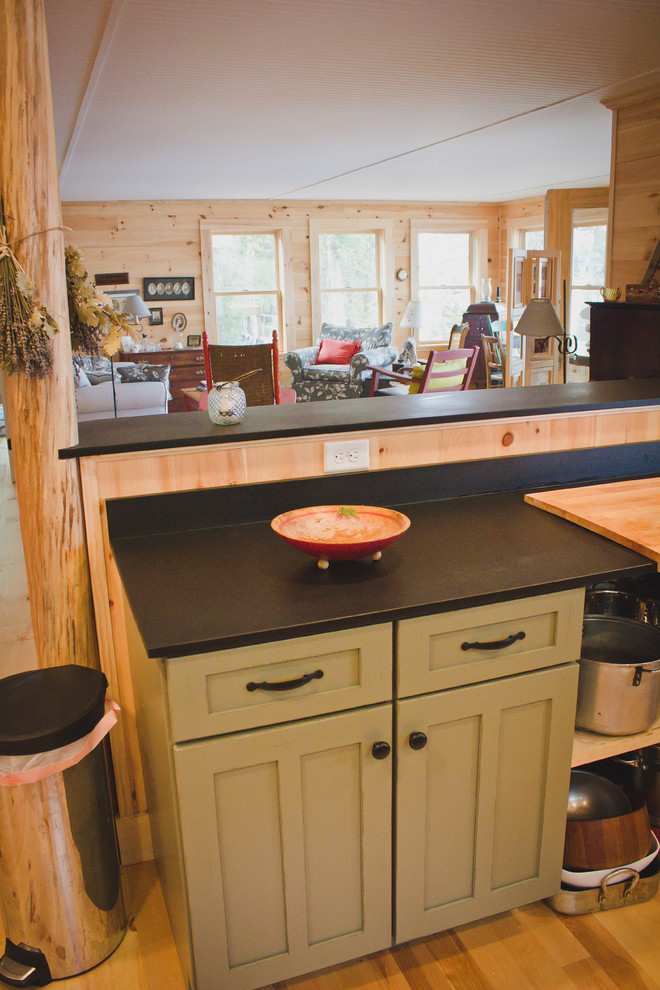 Country u-shaped open plan kitchen in Portland Maine with a double-bowl sink, shaker cabinets and green cabinets.