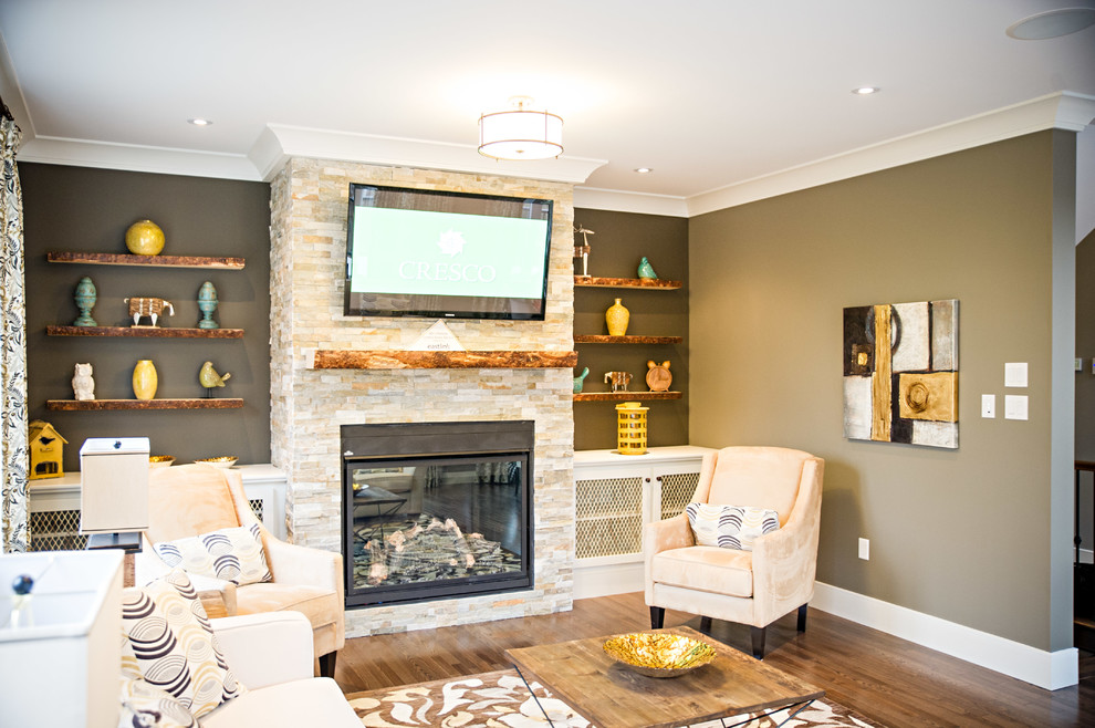 Small transitional formal enclosed living room in Other with grey walls, medium hardwood floors, a standard fireplace, a stone fireplace surround and a wall-mounted tv.