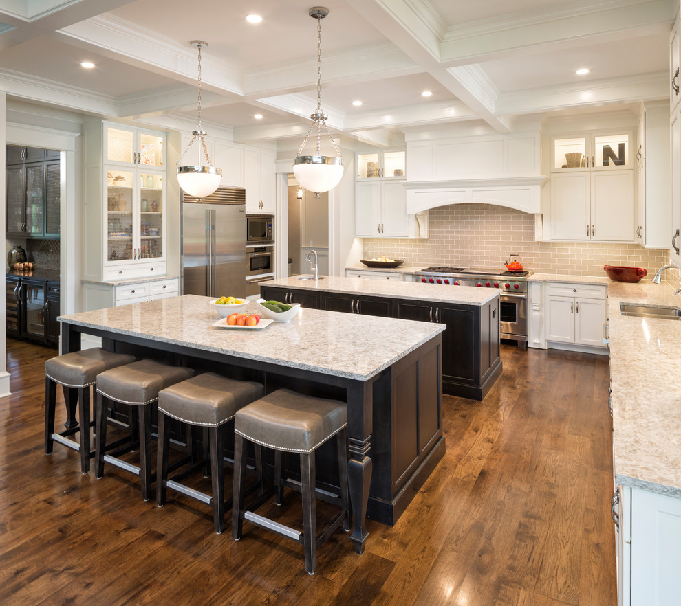 Transitional kitchen photo in Chicago with two islands