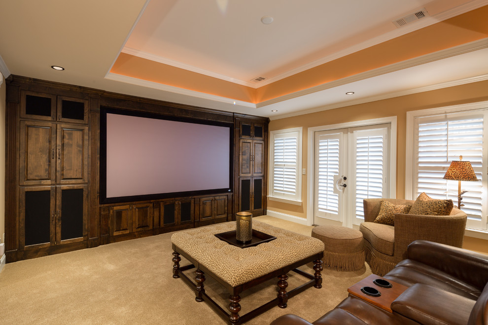 Inspiration for a large traditional open concept home theatre in Atlanta with orange walls, carpet and a projector screen.