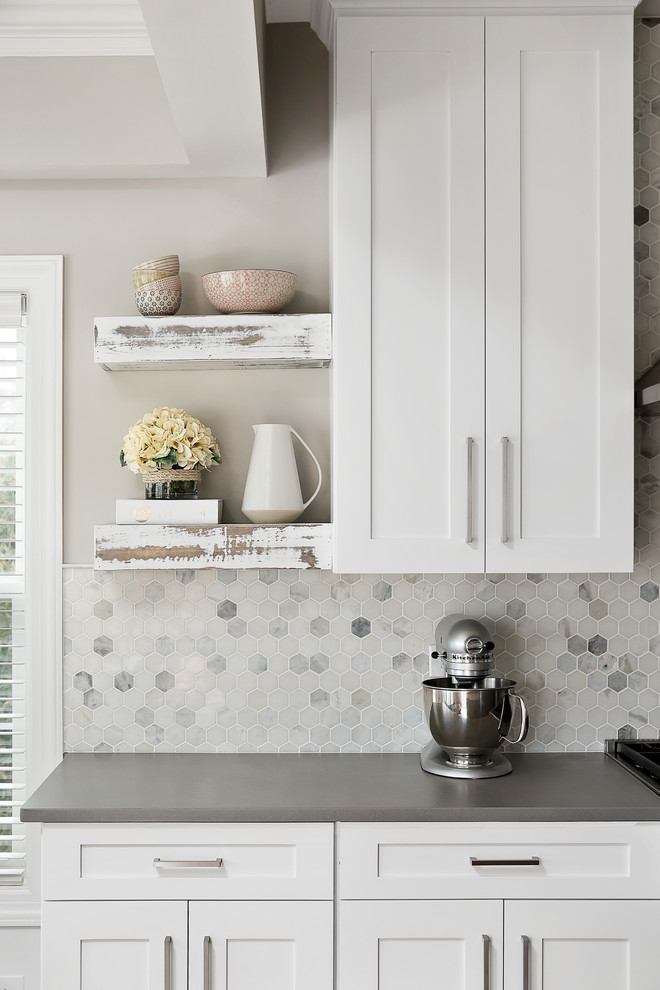 Example of a large transitional light wood floor open concept kitchen design in Chicago with an undermount sink, shaker cabinets, white cabinets, quartz countertops, gray backsplash, marble backsplash, stainless steel appliances and an island