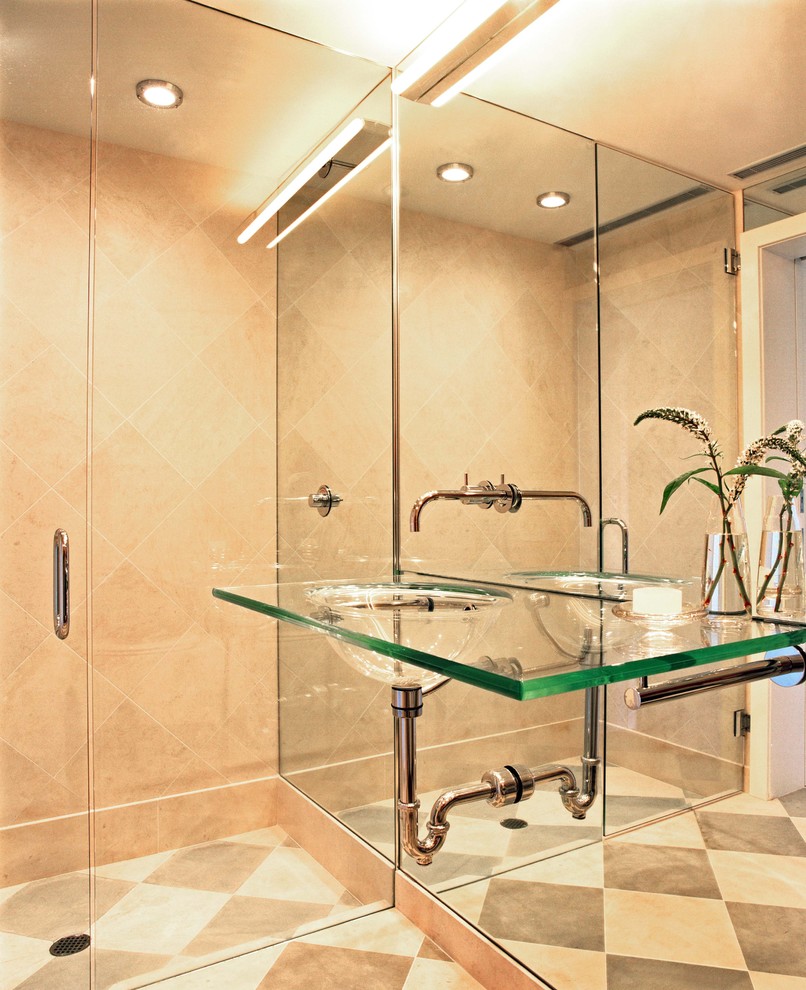 Photo of a contemporary bathroom in San Francisco with an integrated sink, glass benchtops, an alcove shower and beige tile.