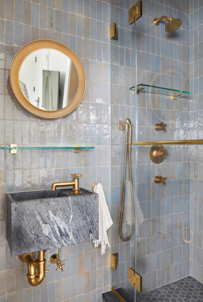 Bathroom - coastal blue tile bathroom idea in New York with blue walls, a wall-mount sink and a hinged shower door