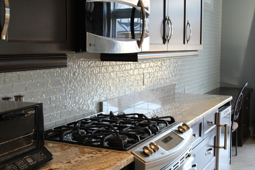 Kitchen - transitional kitchen idea in Toronto with dark wood cabinets, white backsplash and glass tile backsplash
