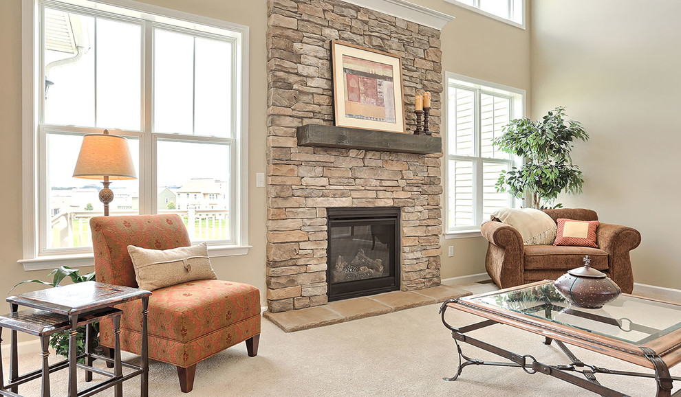 Large traditional open concept family room in Other with carpet, a standard fireplace and a stone fireplace surround.