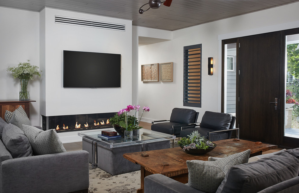Contemporary formal living room in Grand Rapids with white walls, a ribbon fireplace and a wall-mounted tv.