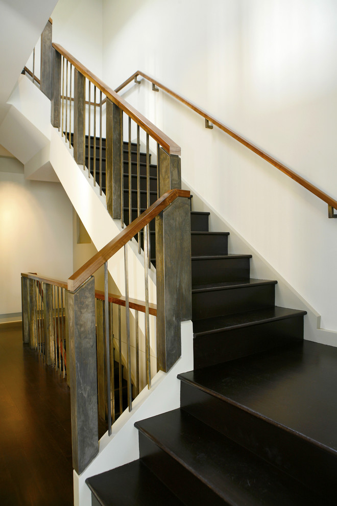 Industrial wood staircase in San Francisco with wood risers and mixed railing.