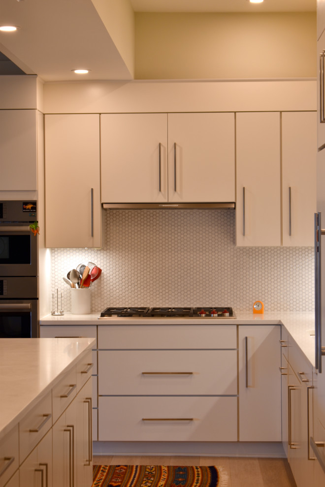 Design ideas for a large contemporary l-shaped open plan kitchen in Boston with flat-panel cabinets, white cabinets, quartz benchtops, white splashback, mosaic tile splashback, with island and yellow benchtop.