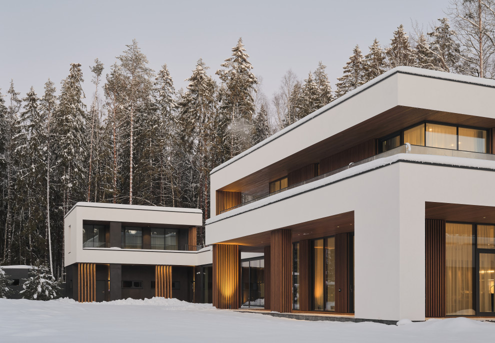 Idee per la villa grande bianca contemporanea a due piani con rivestimenti misti, tetto piano, copertura mista, tetto nero e pannelli sovrapposti