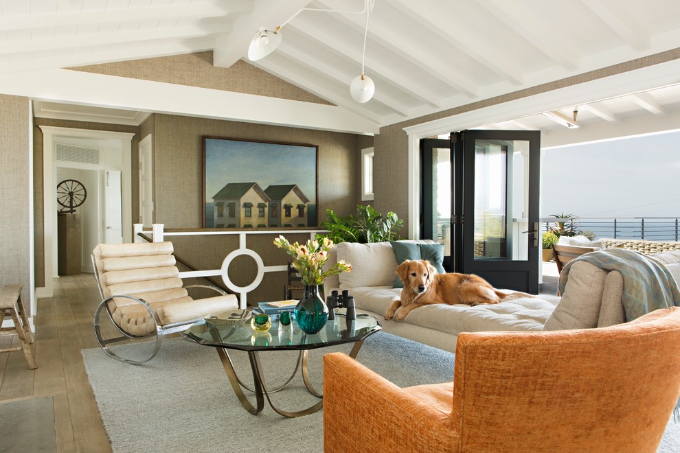 Inspiration for a beach style formal open concept living room in Orange County with grey walls and light hardwood floors.