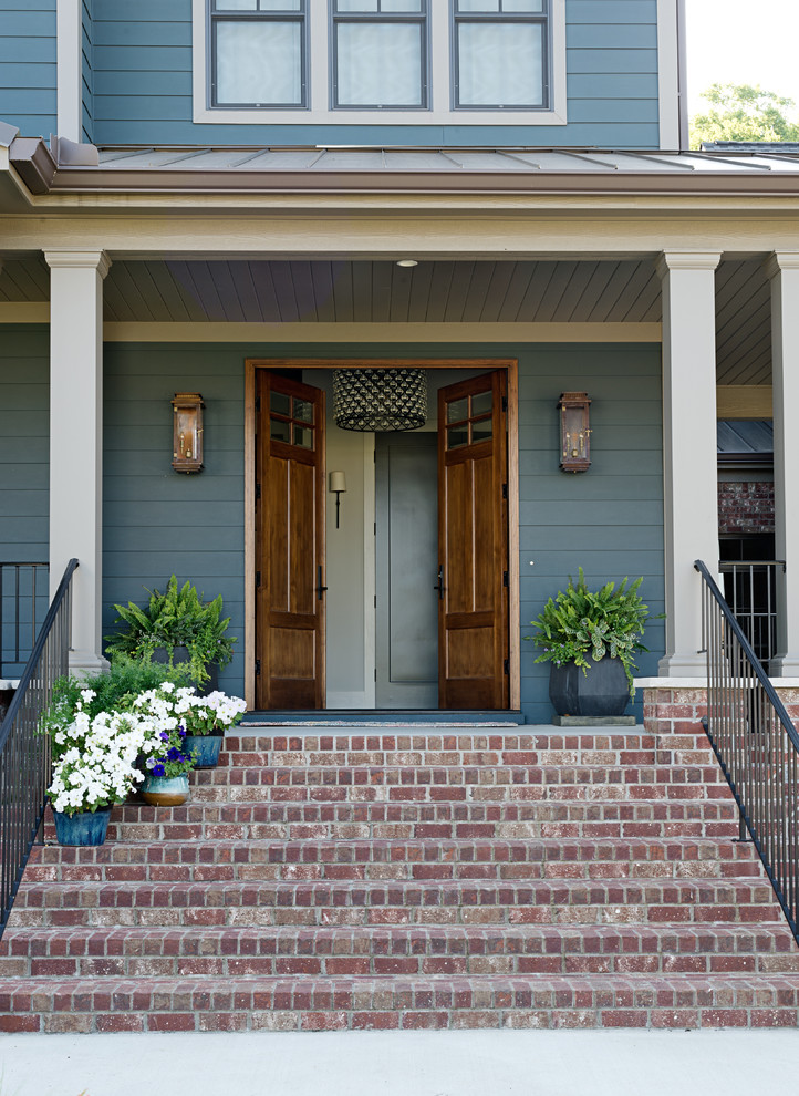 Design ideas for a mid-sized transitional front door in Other with a double front door and a medium wood front door.