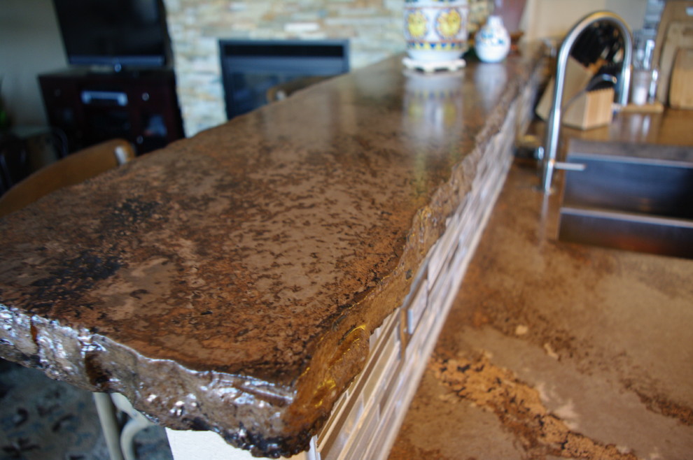 Inspiration for a rustic eat-in kitchen remodel in Denver with white cabinets and concrete countertops