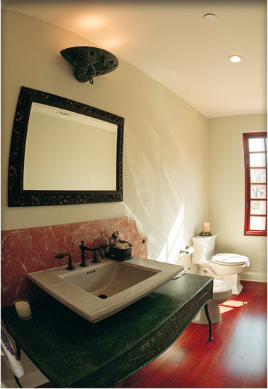 Design ideas for a mid-sized eclectic 3/4 bathroom in Los Angeles with a two-piece toilet, beige walls, medium hardwood floors and a vessel sink.
