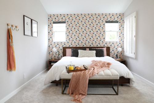 mid century modern bedroom with wall papered accent wall