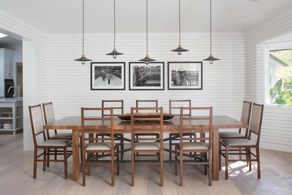 Mid-sized country separate dining room in Los Angeles with white walls, light hardwood floors and brown floor.