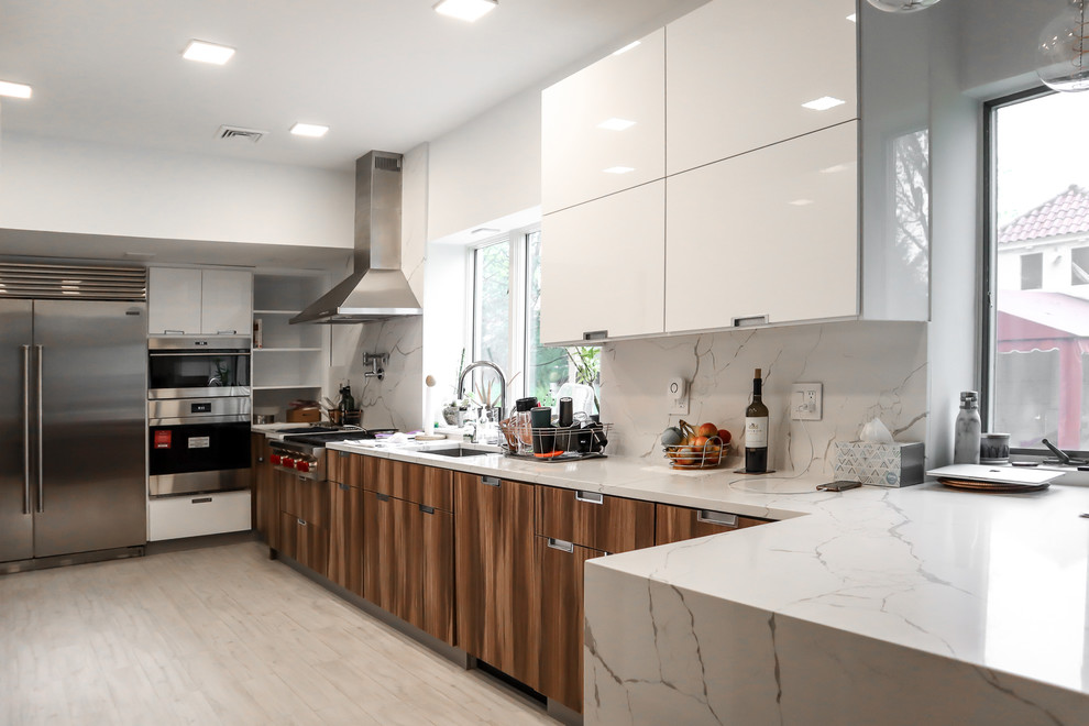 Large modern kitchen in New York with flat-panel cabinets.