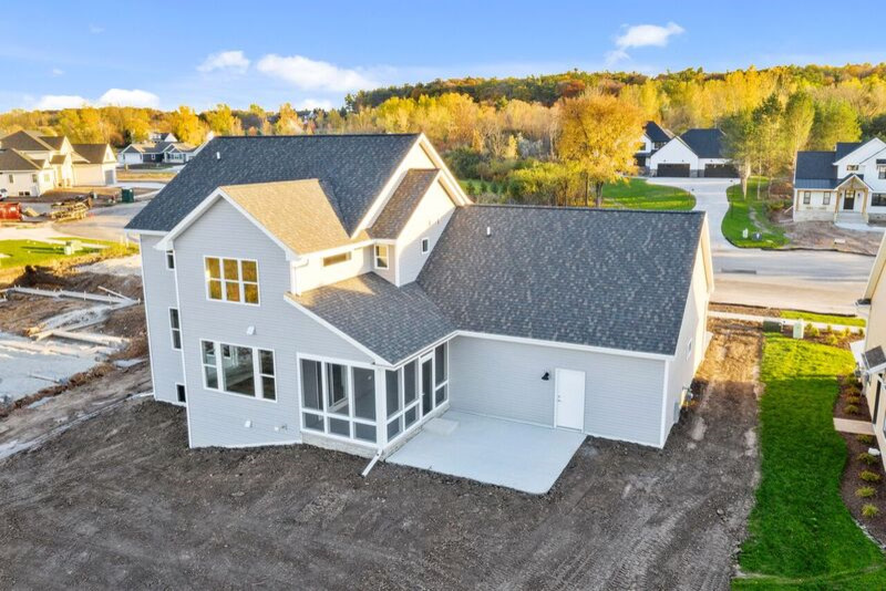 Inspiration for a mid-sized transitional gray two-story mixed siding gable roof remodel with a shingle roof