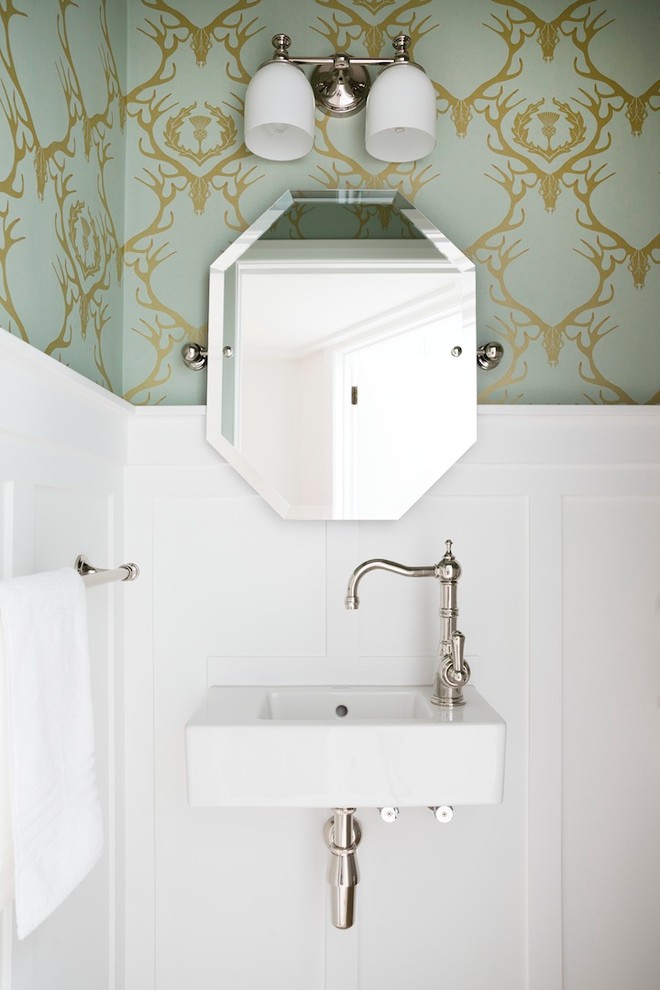 This is an example of a small traditional powder room in Auckland with a wall-mount sink and multi-coloured walls.