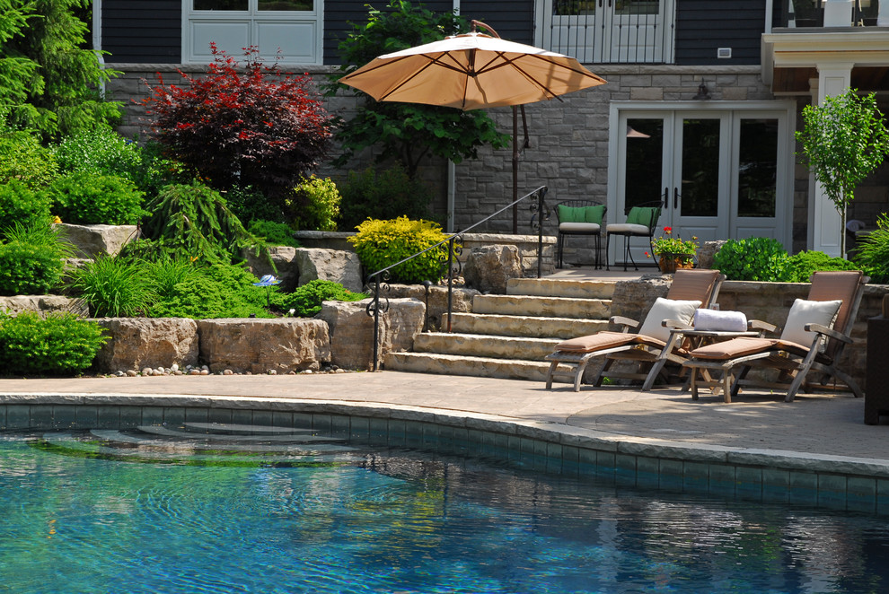Photo of a large rustic partial sun backyard concrete paver outdoor basketball/tennis/multi-game court in Toronto for summer.