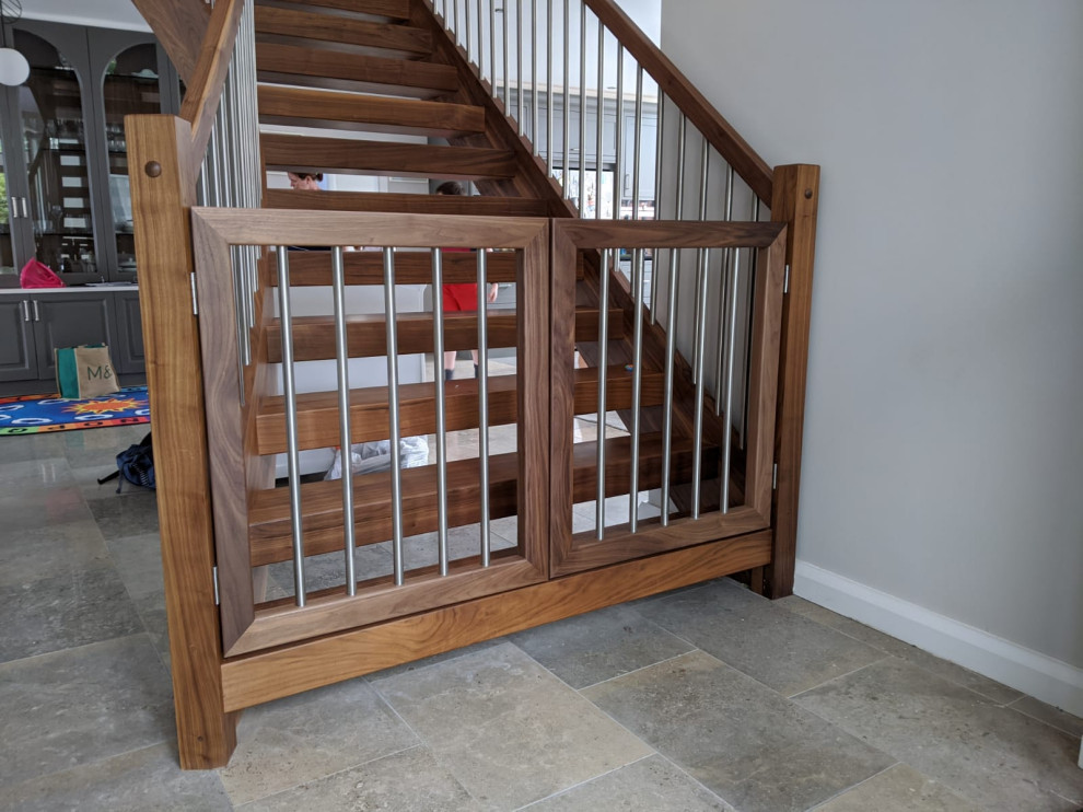 Photo of a medium sized contemporary wood curved staircase in Other.