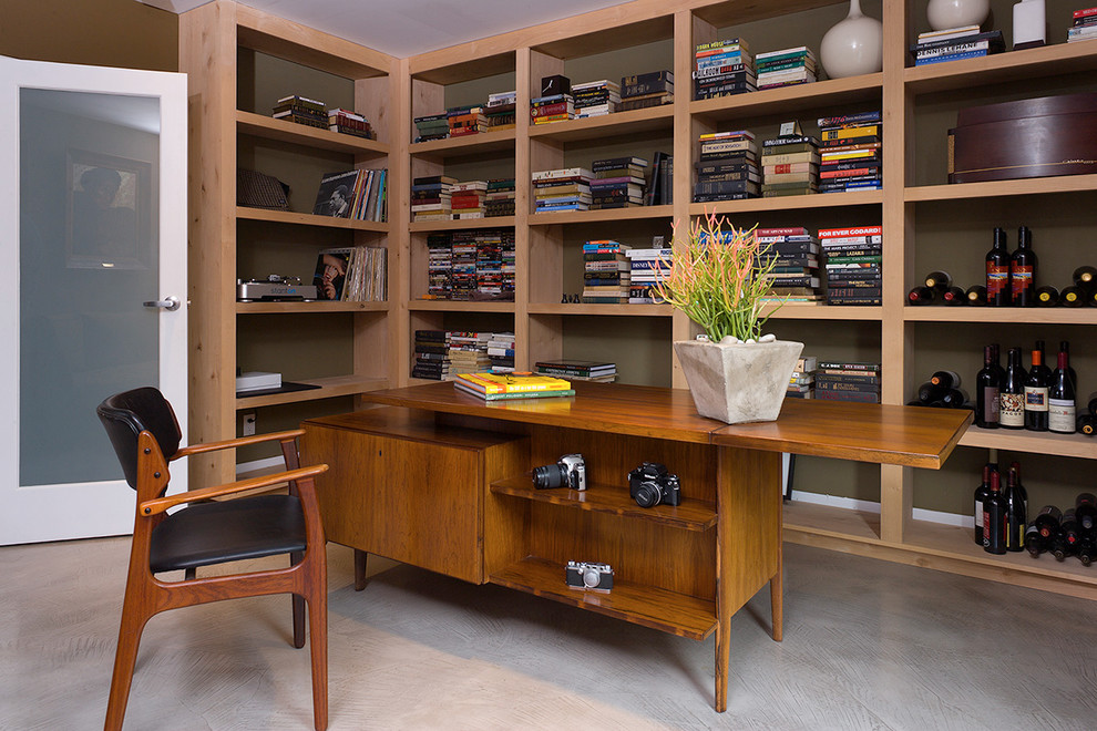 This is an example of a contemporary home office in New Orleans with a freestanding desk.