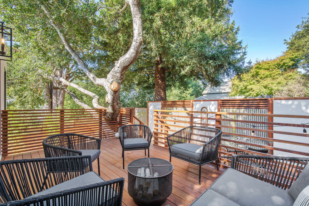 Mid-sized contemporary backyard and first floor deck in San Francisco with no cover and wood railing.