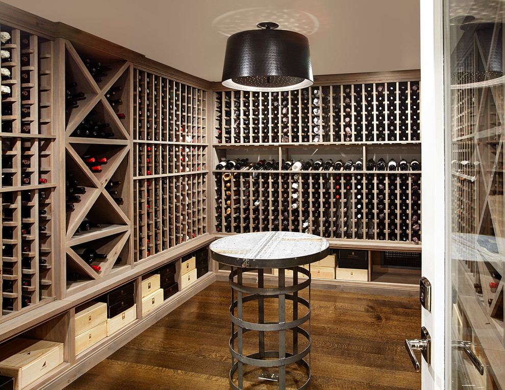 Mid-sized transitional wine cellar in Other with dark hardwood floors, storage racks and yellow floor.