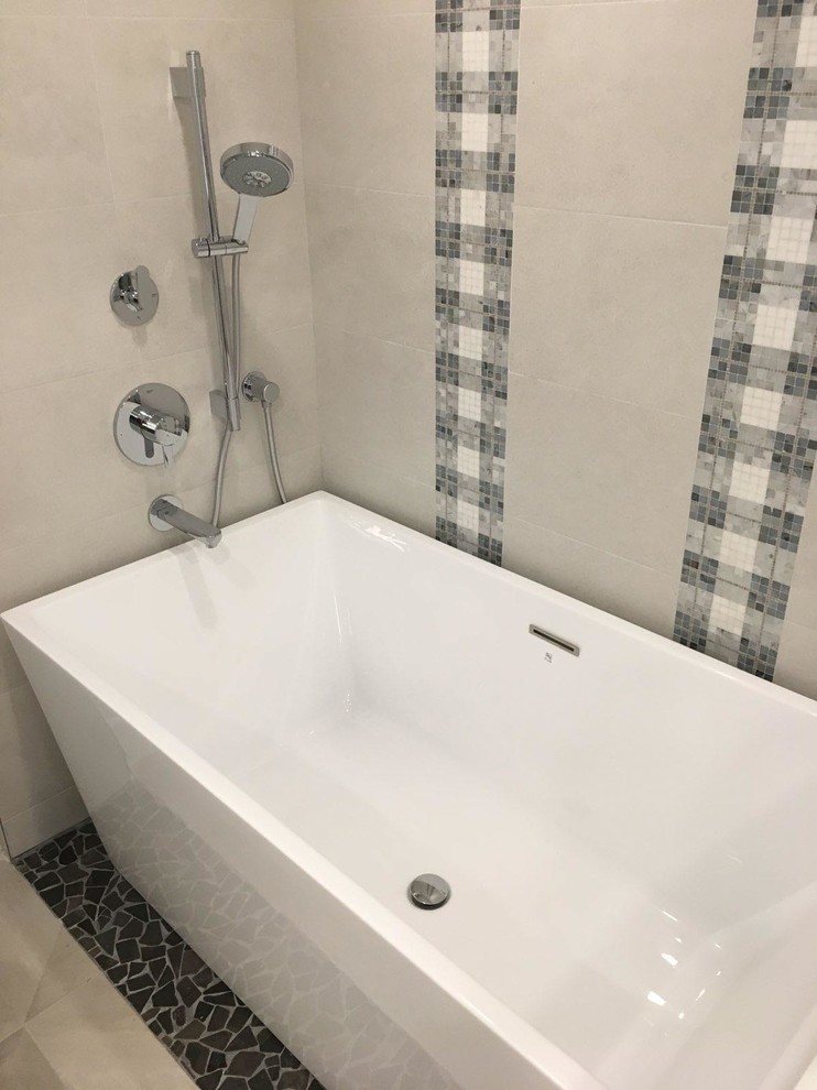 Inspiration for a mid-sized contemporary master bathroom in Miami with flat-panel cabinets, dark wood cabinets, a freestanding tub, a corner shower, a one-piece toilet, white tile, porcelain tile, grey walls, porcelain floors, an undermount sink, engineered quartz benchtops, beige floor and a hinged shower door.