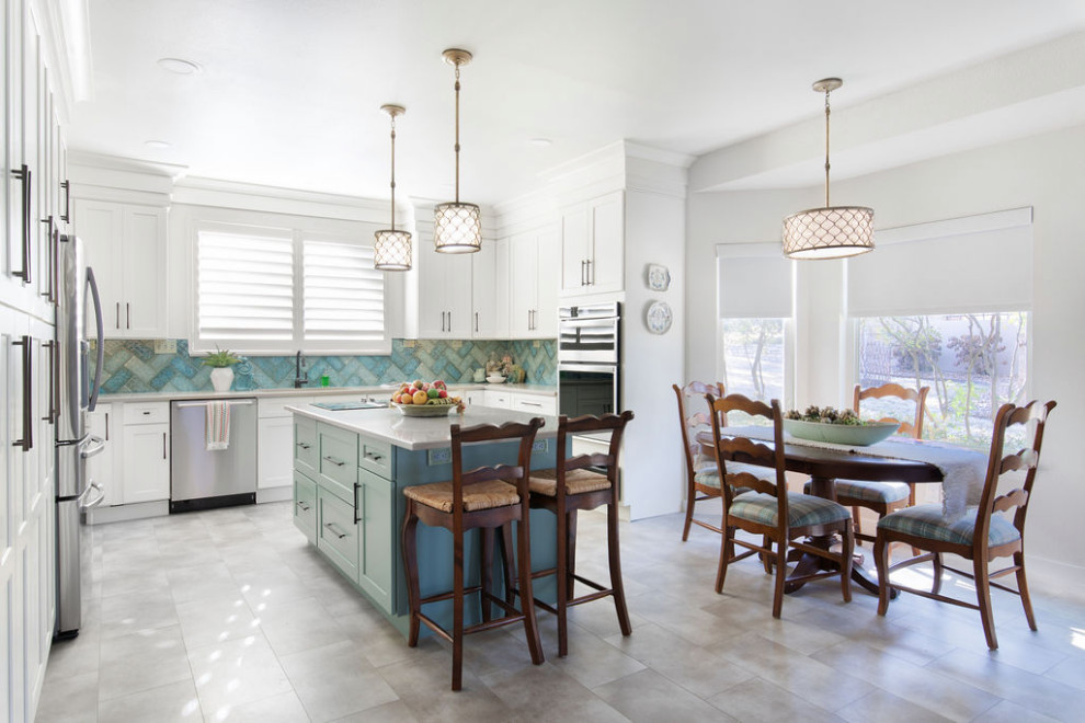 Barker Ridge Drive - Inspiration for an eclectic u-shaped kitchen remodel in Austin with an undermount sink, quartzite countertops, stainless steel appliances, an island and ceramic backsplash